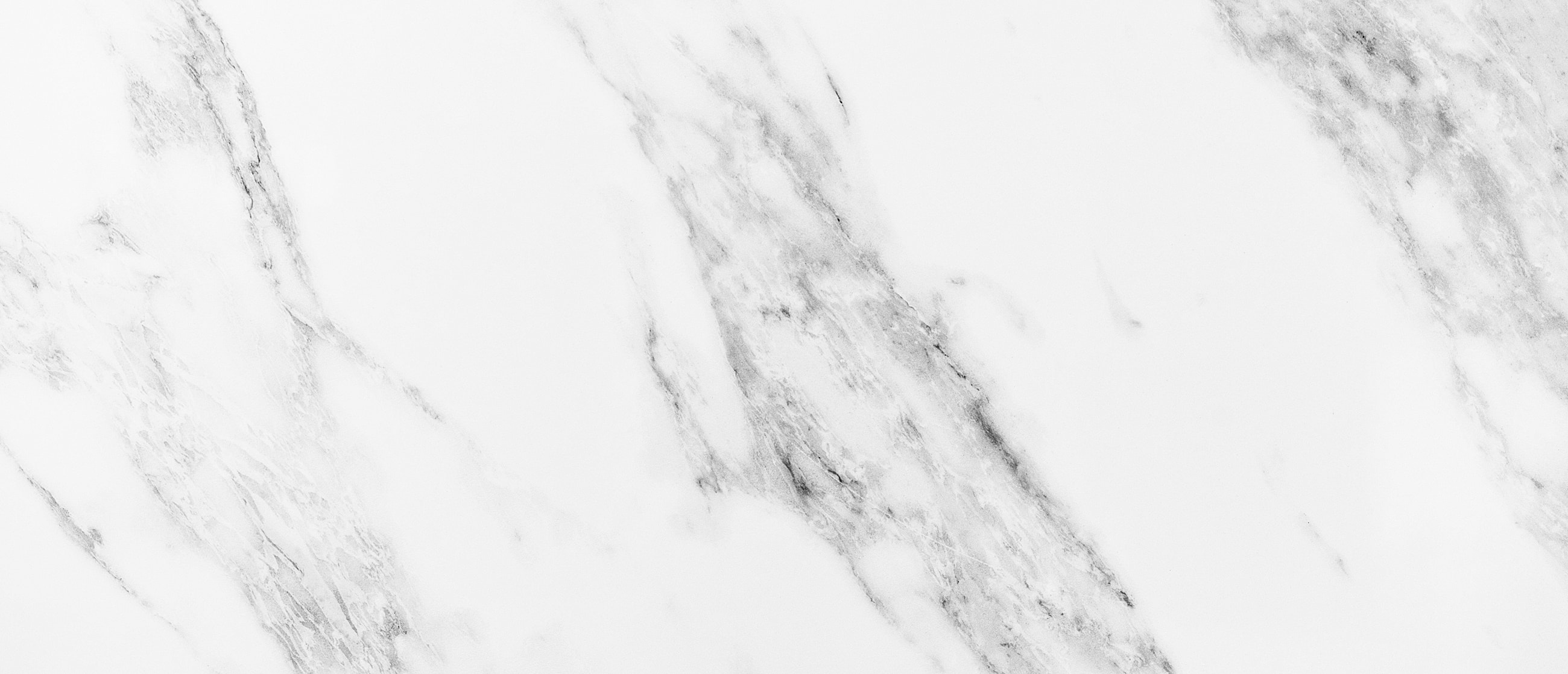 White marble texture with grey veining.