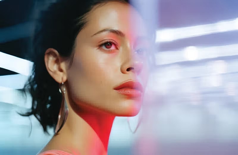 Profile of a woman with dramatic lighting.