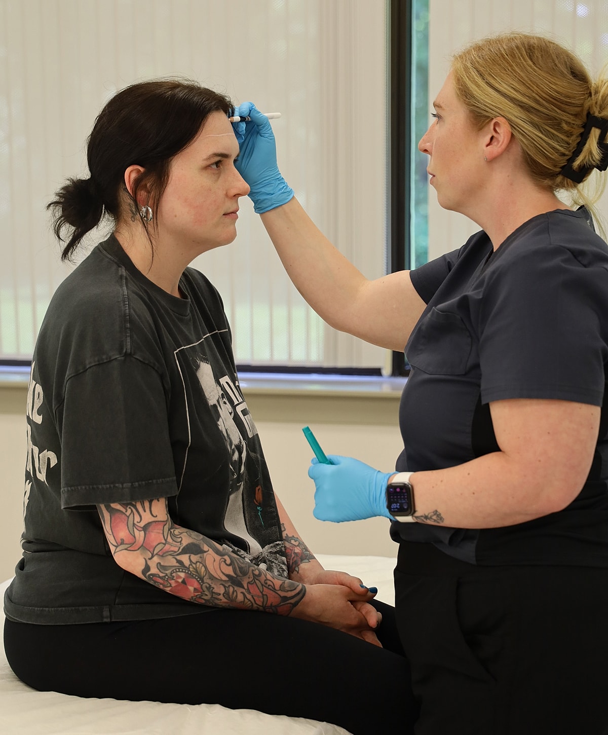Women discussing and reflecting in a mirror.