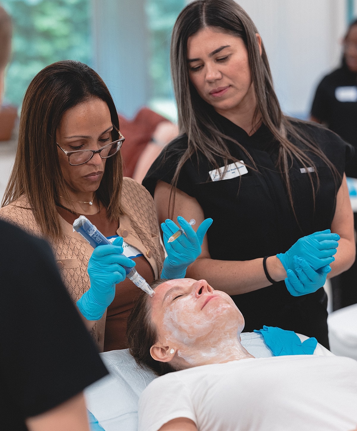 Facial treatment in a skincare training session.