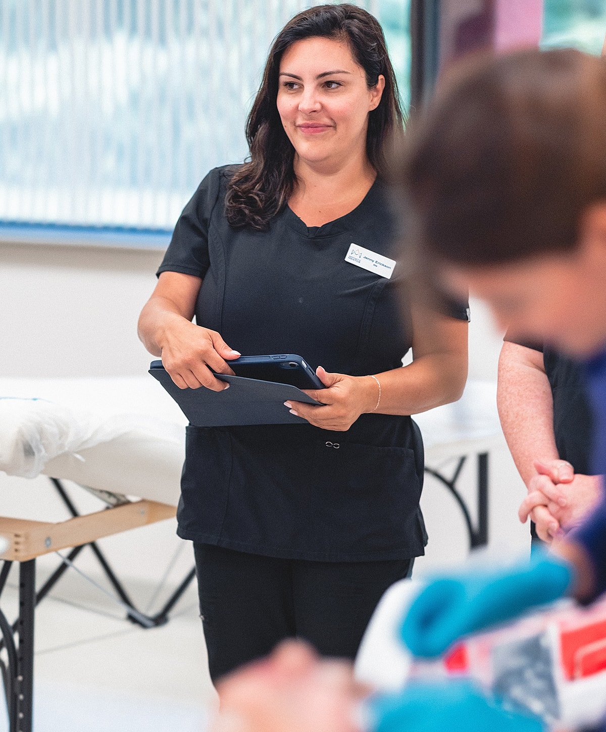Medical professional preparing a syringe for injection.