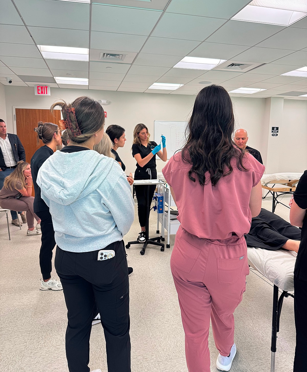Model in black lingerie, side profile shot.