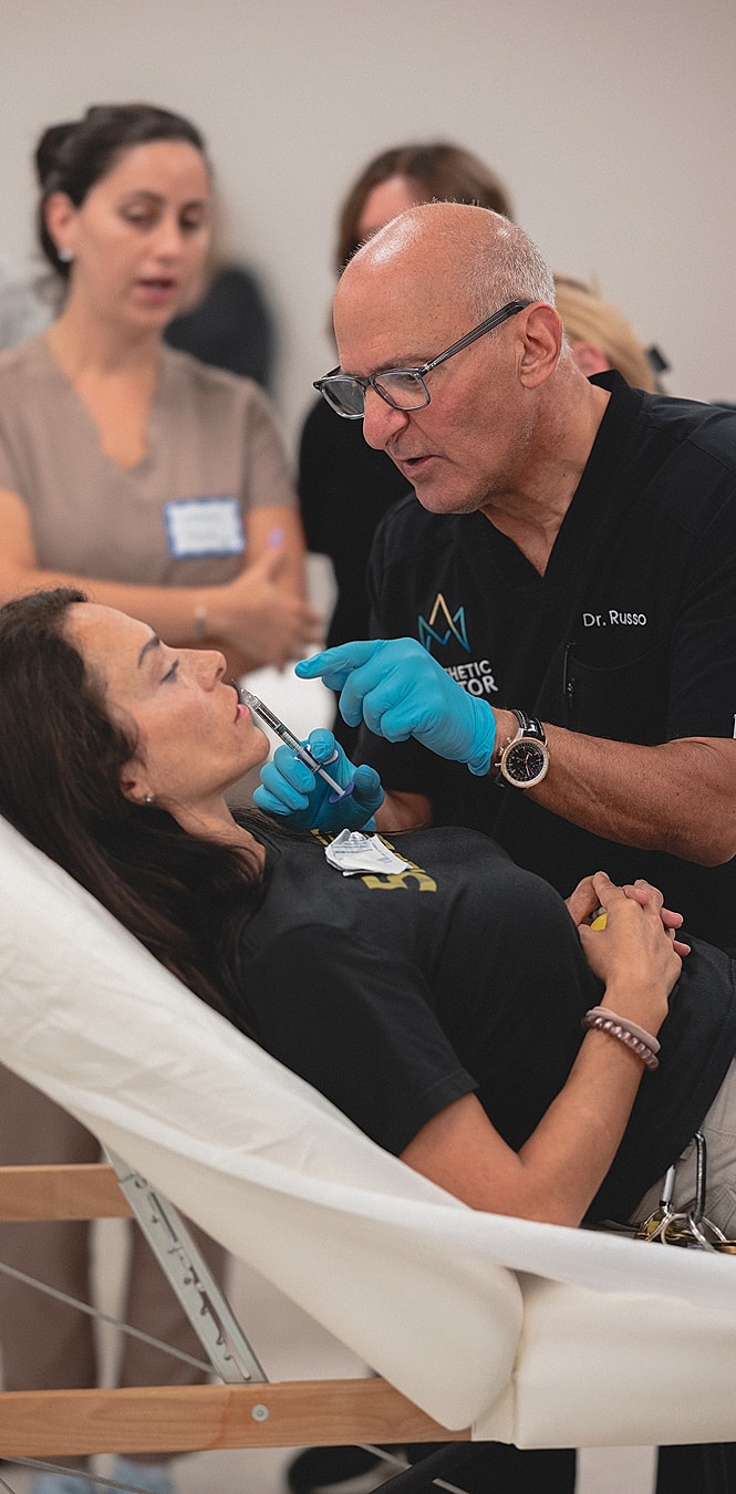 Medical professional performing treatment on a patient.