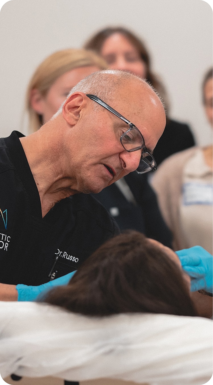 Doctor performing a treatment on a patient.