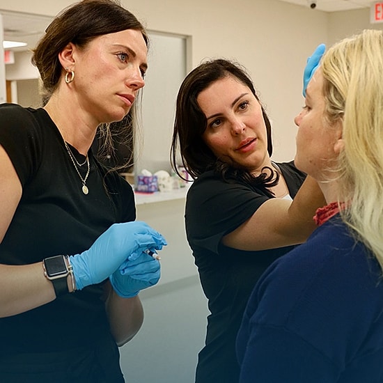 Medical professionals consulting with a patient.