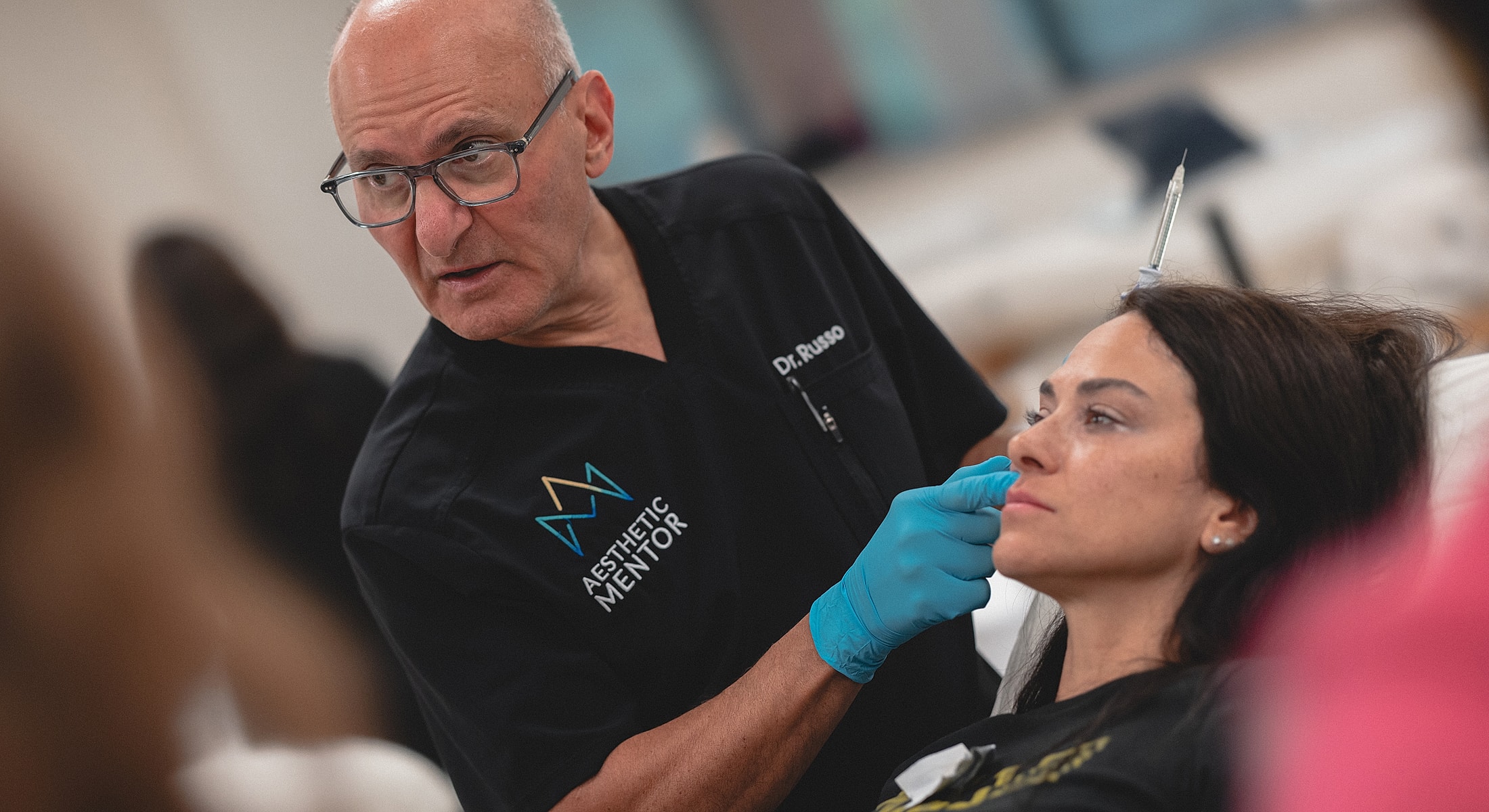 Cosmetic procedure demonstration by medical professional.