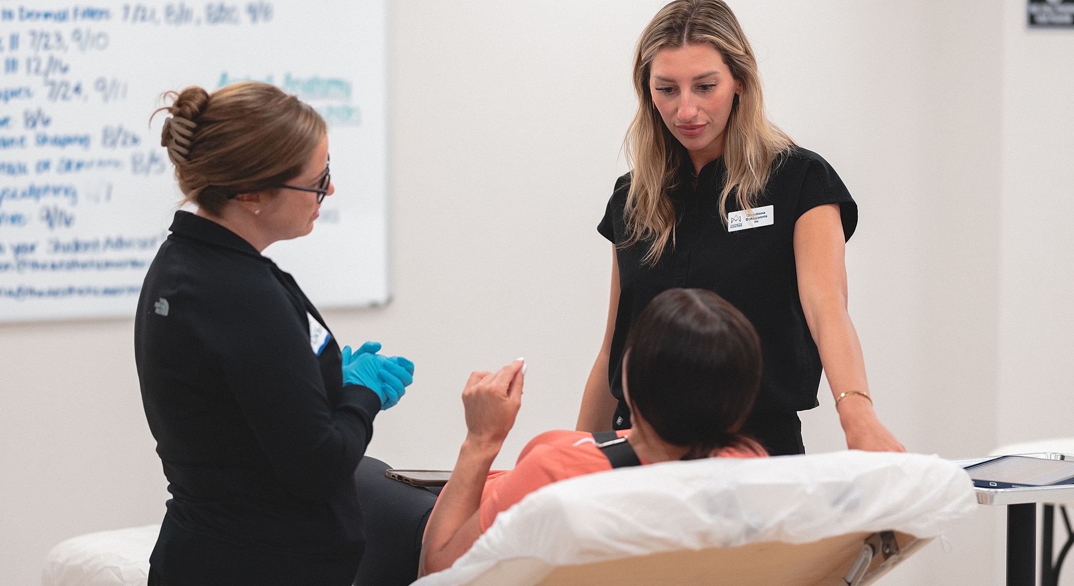 Healthcare professionals interacting with a patient.